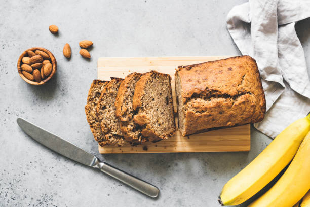 Gluten free paleo banana bread table top view Gluten free paleo banana bread on grey concrete background, table top view wholegrain flour stock pictures, royalty-free photos & images