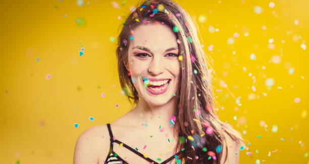 istock Young Woman With Confetti 1147312632
