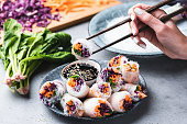 Eating Asian Cuisine Spring Rolls