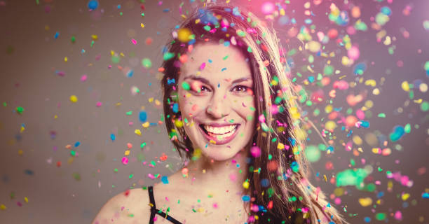 istock Young Woman With Confetti 1147312753