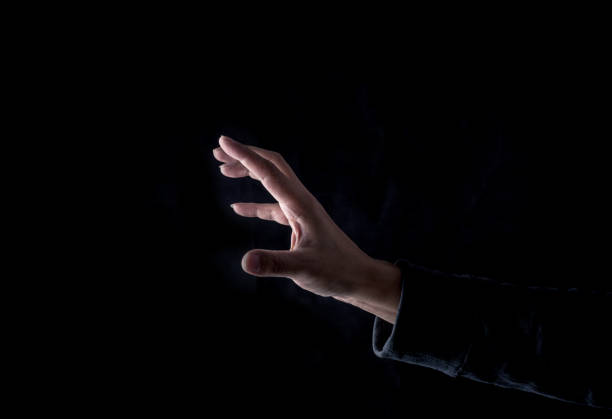 istock Raise your finger on a black background 1147313168