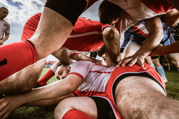 Scrum on rugby match! Large group of rugby players in scrum on a match. scrum stock pictures, royalty-free photos & images