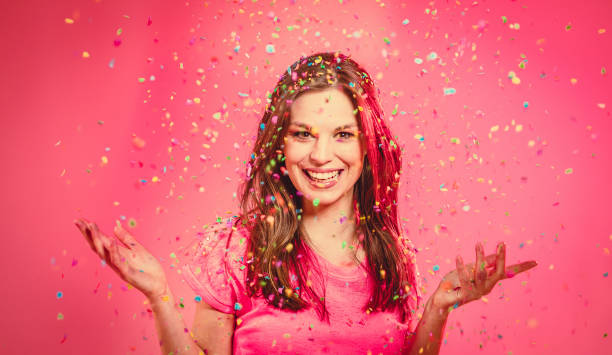 istock Young Woman With Confetti 1147314414