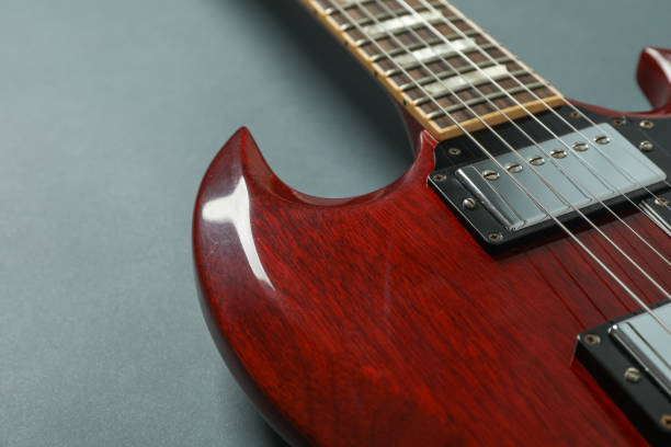 istock Beautiful six - string electric guitar on dark background, closeup 1147314428