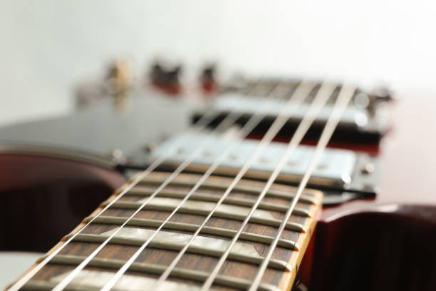 istock Beautiful six - string electric guitar on white background, closeup 1147314629