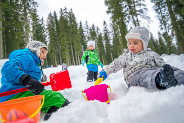 istock Children playing in snow 1147315419