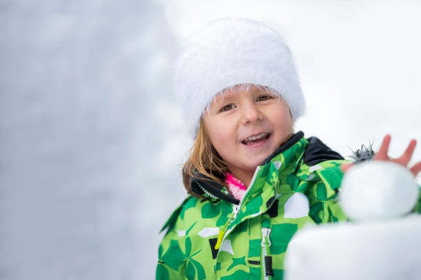 istock Girl playing with snow 1147315428