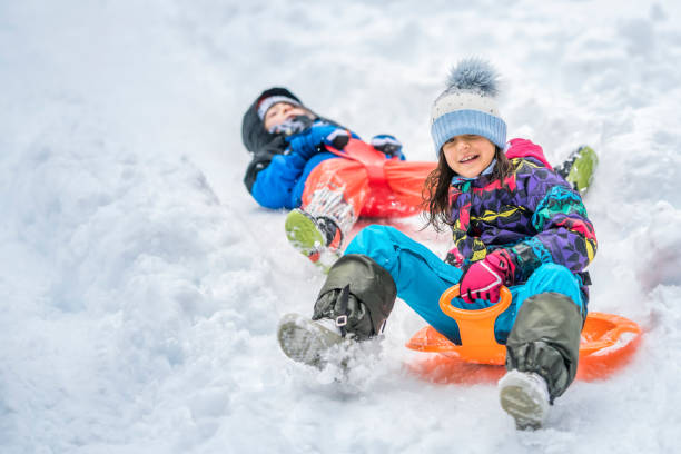 istock Children sliding on snow 1147315455