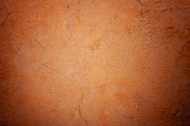 istock Abstract terracotta rustic orange textured background with lots of cracks and character. 1147316320