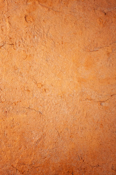 istock Abstract terracotta rustic orange textured background with lots of cracks and character. 1147316322