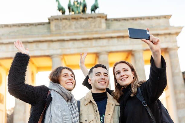 istock Friends at Brandeburg Gate in Berlin take a selfie 1147316979
