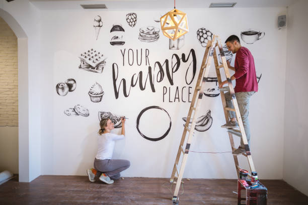 istock Handsome artist couple having a short chat about new ideas they could implement into their style 1147317026