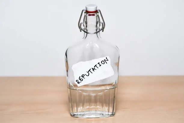 Photo of Bottle with a REPUTATION note bonded