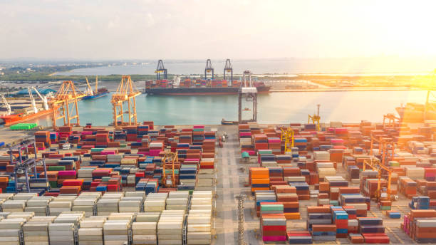 istock Container ship in export and import business logistics and transportation. Cargo and container box shipping to harbor by crane. Water transport International. Aerial view and top view. 1147323255