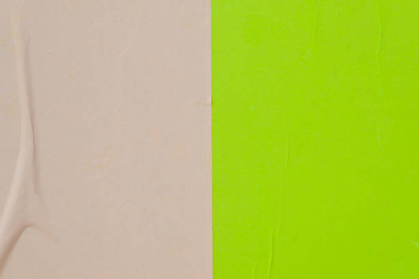 istock Two sheets of colored paper pasted on the wall. 1147323322