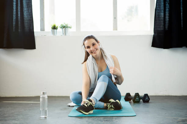 istock Young woman taking a break from workout 1147324238