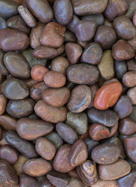 istock smooth colored pebbles, decorative background of stones 1147324760