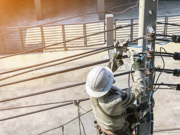 istock Electricians are climbing on electric poles 1147324984