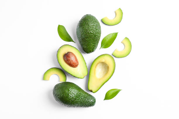 istock Flat lay composition with ripe avocados and leaves on white background, space for text 1147325592