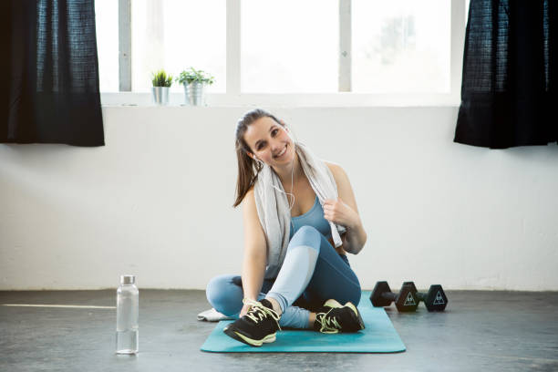 istock Young woman taking a break from workout 1147325671