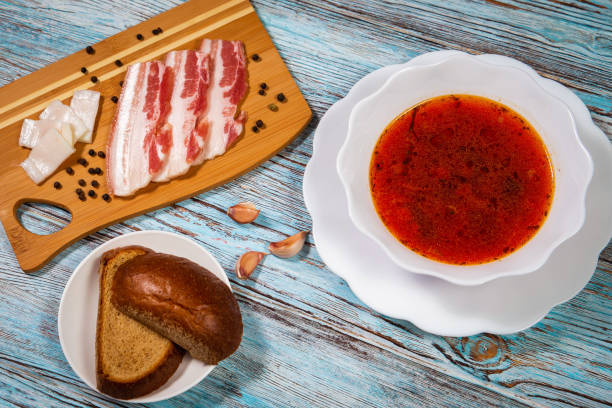 istock borsch, bacon with garlic and rye bread on a wooden background 1147325940
