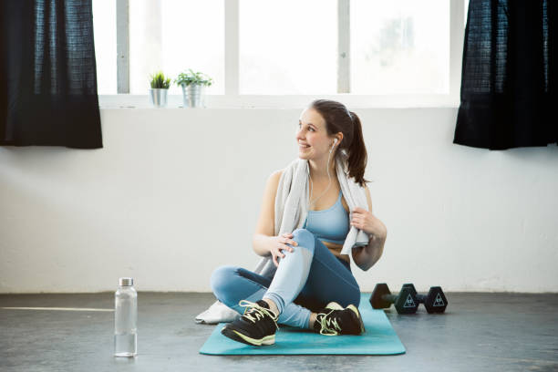 istock Young woman taking a break from workout 1147326063