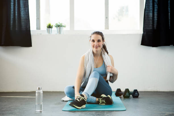 istock Young woman taking a break from workout 1147326393