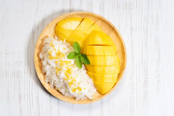 fresh ripe mango and sticky rice with coconut milk, authentic Thai dessert
