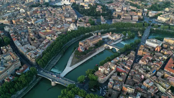 Photo of Aerial view of hospital on the Tiber Island, on the Tiber River, Rome, Italy. Coliseum.