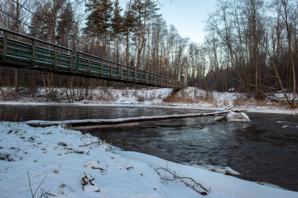 istock almost frozen river in winter 1147328389