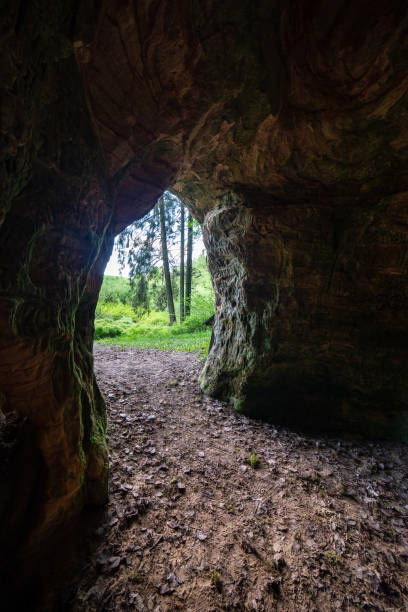 istock sandstone cave entrance in dark 1147328546