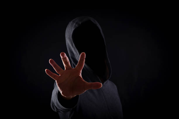 istock Men in hoodies in black background 1147331212
