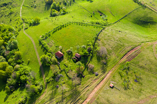 Aerial view of a countryside homestead houses in the mountains by drone