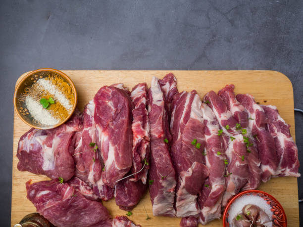 istock fresh pork with ingredients for cooking on dark background 1147332652