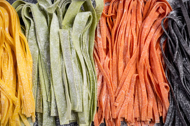 istock Homemade uncooked colorful tagliatelle pasta 1147333066