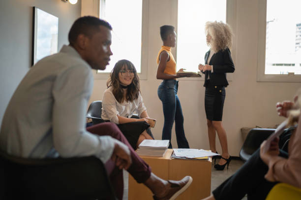 istock Conference room with business people talking on coffee break 1147335655