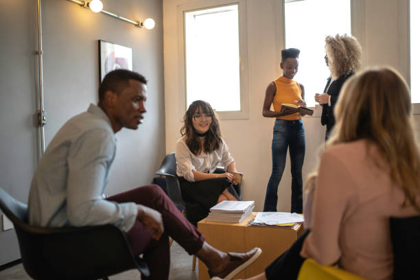 istock Conference room with business people talking on coffee break 1147336114