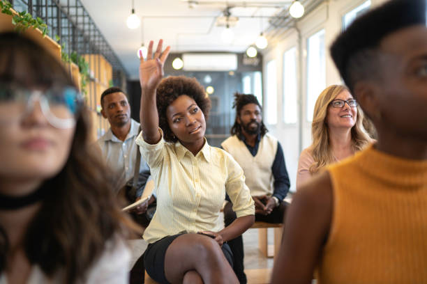istock Group of business people talking during seminar 1147337297
