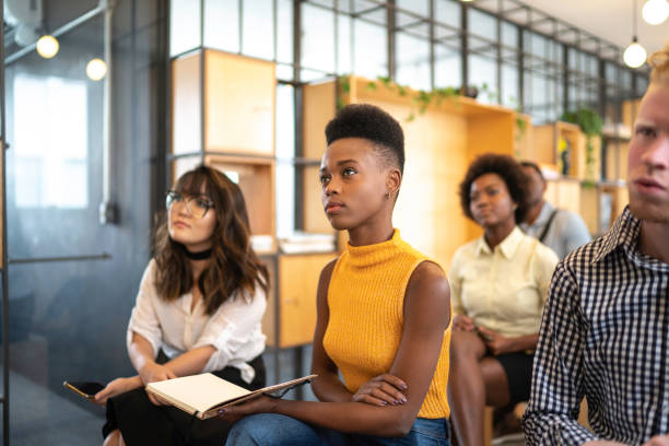 istock Group of business people talking during seminar 1147337537