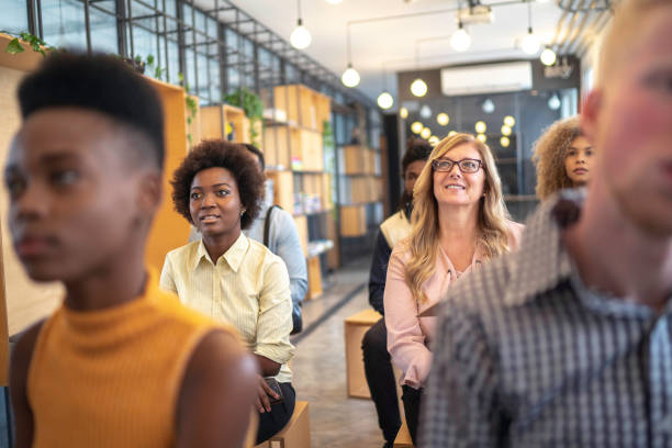 istock Group of business people talking during seminar 1147337621