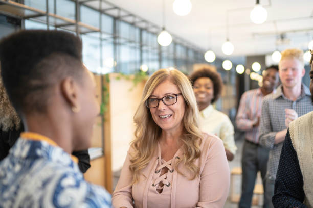 istock Businesswoman congratulating speaker after seminar 1147338239