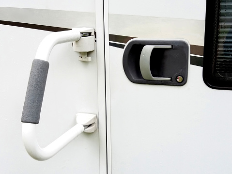 Handle outside camper also for double locking the camper