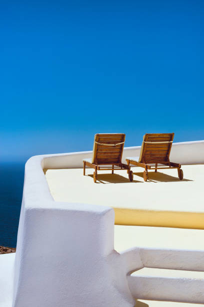 istock Chairs On Balcony Overlooking The Sea In Santorini 1147341693