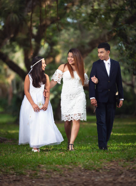 istock First communion day mother and children 1147342000