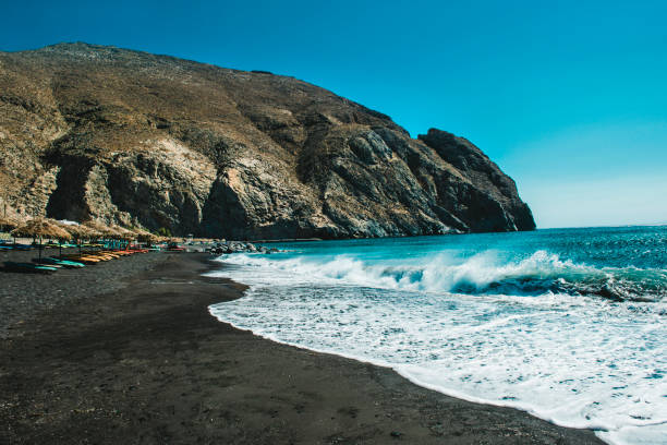 waves, beach and tranquility in santorini, greece - caldera imagens e fotografias de stock