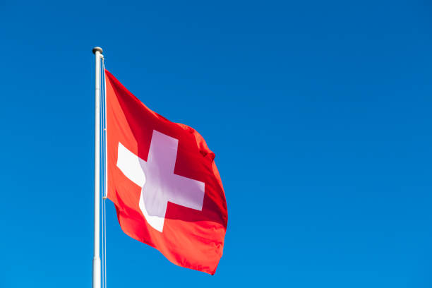 swiss flag - clear sky sky sunny day isolated imagens e fotografias de stock