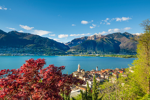 View to the small village of Vira in the foreground and the the village of Tenero Contra in the background at the Swiss part of the beautiful lake Lago Maggiore.