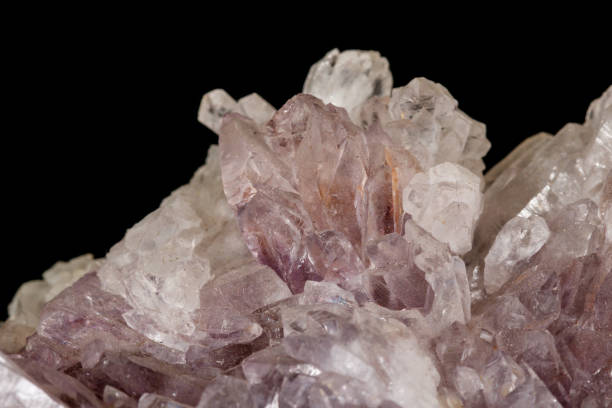 istock Macro of amethyst mineral stone on black background 1147348310