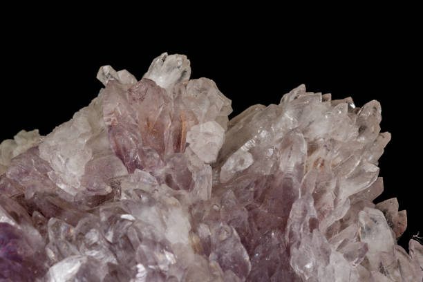 istock Macro of amethyst mineral stone on black background 1147348530