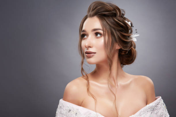 istock woman with nice make-up and hairstyle looking up 1147348894